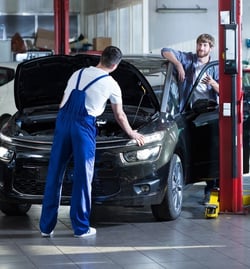 Automotive technician repairing a car in a garage-379412-edited.jpeg
